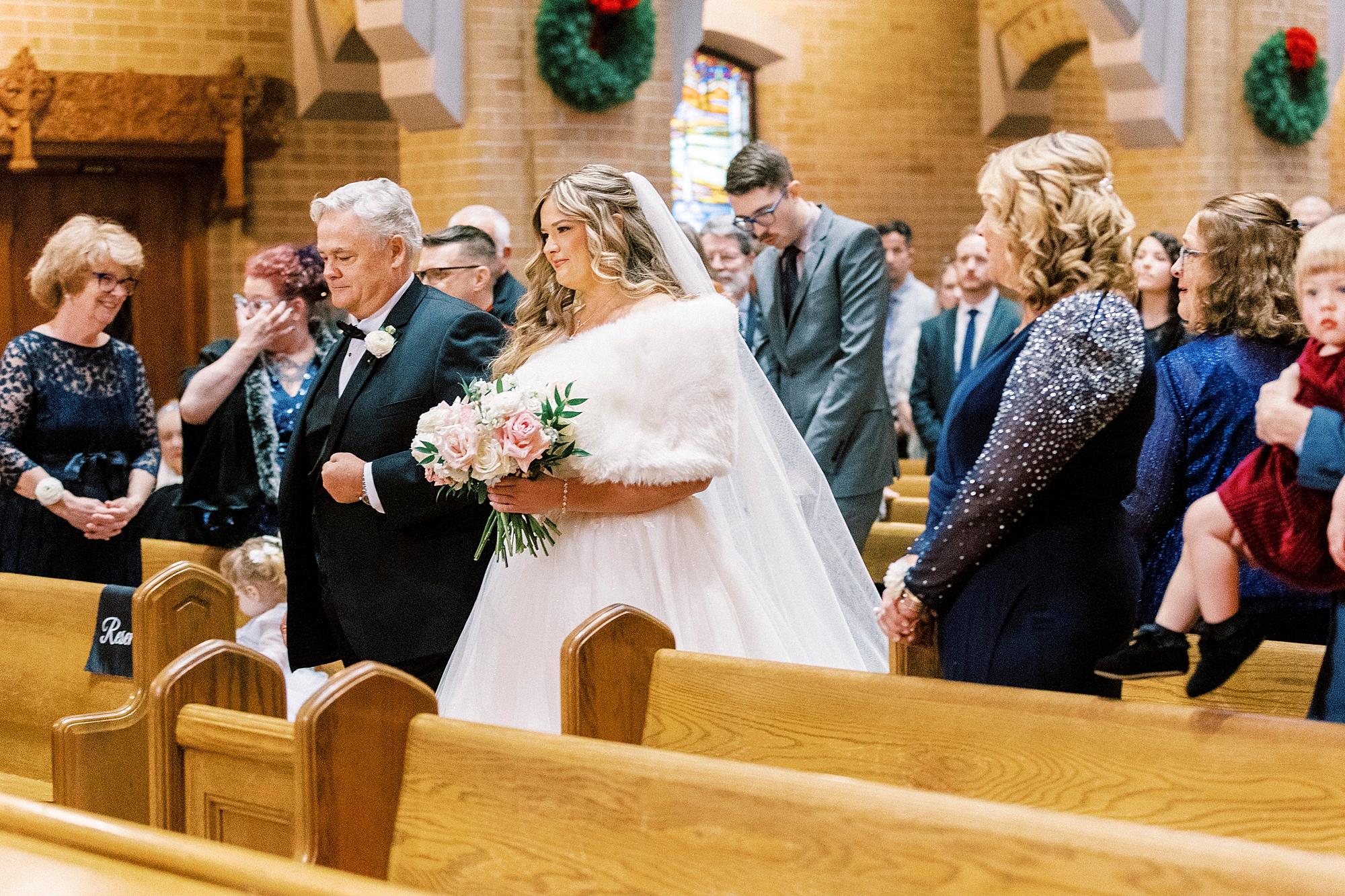father escorts bride down aisle at Our Lady of Grace
