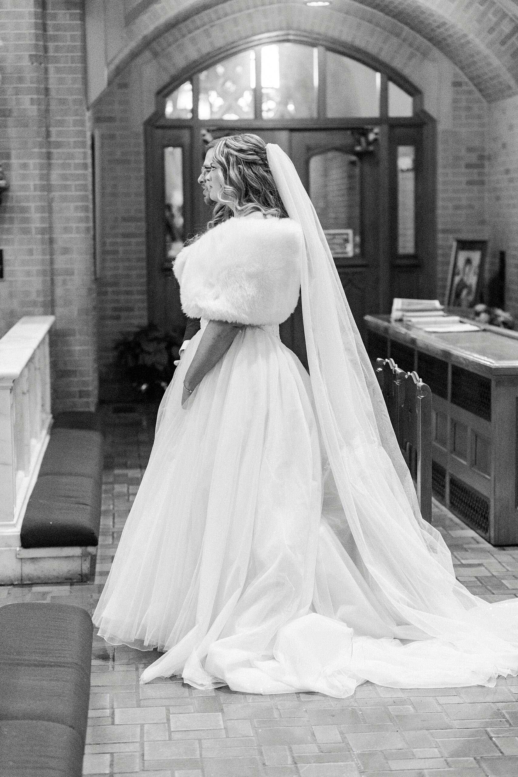bride stands inside church in Greensboro NC