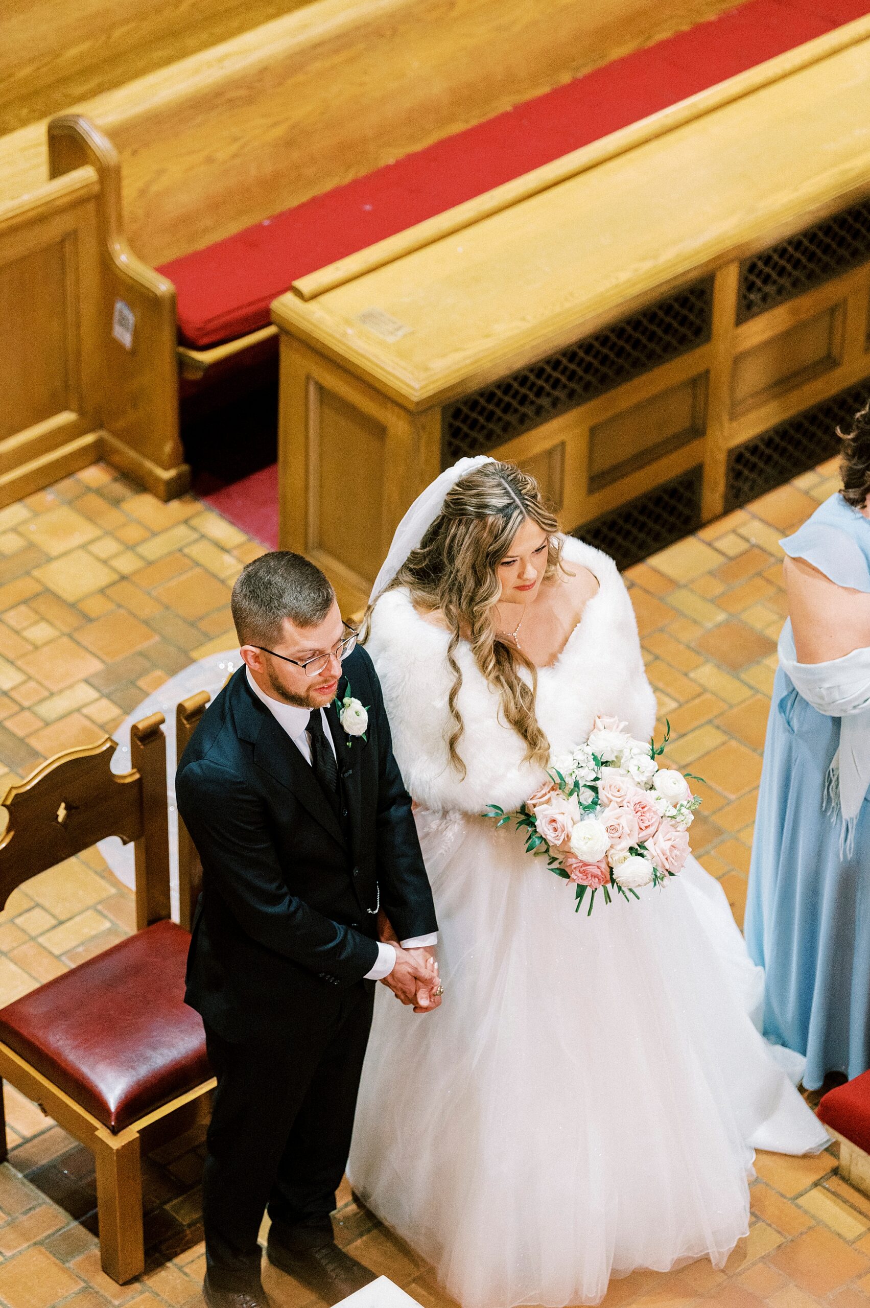 view of bride and groom from balcony inside Greensboro NC church