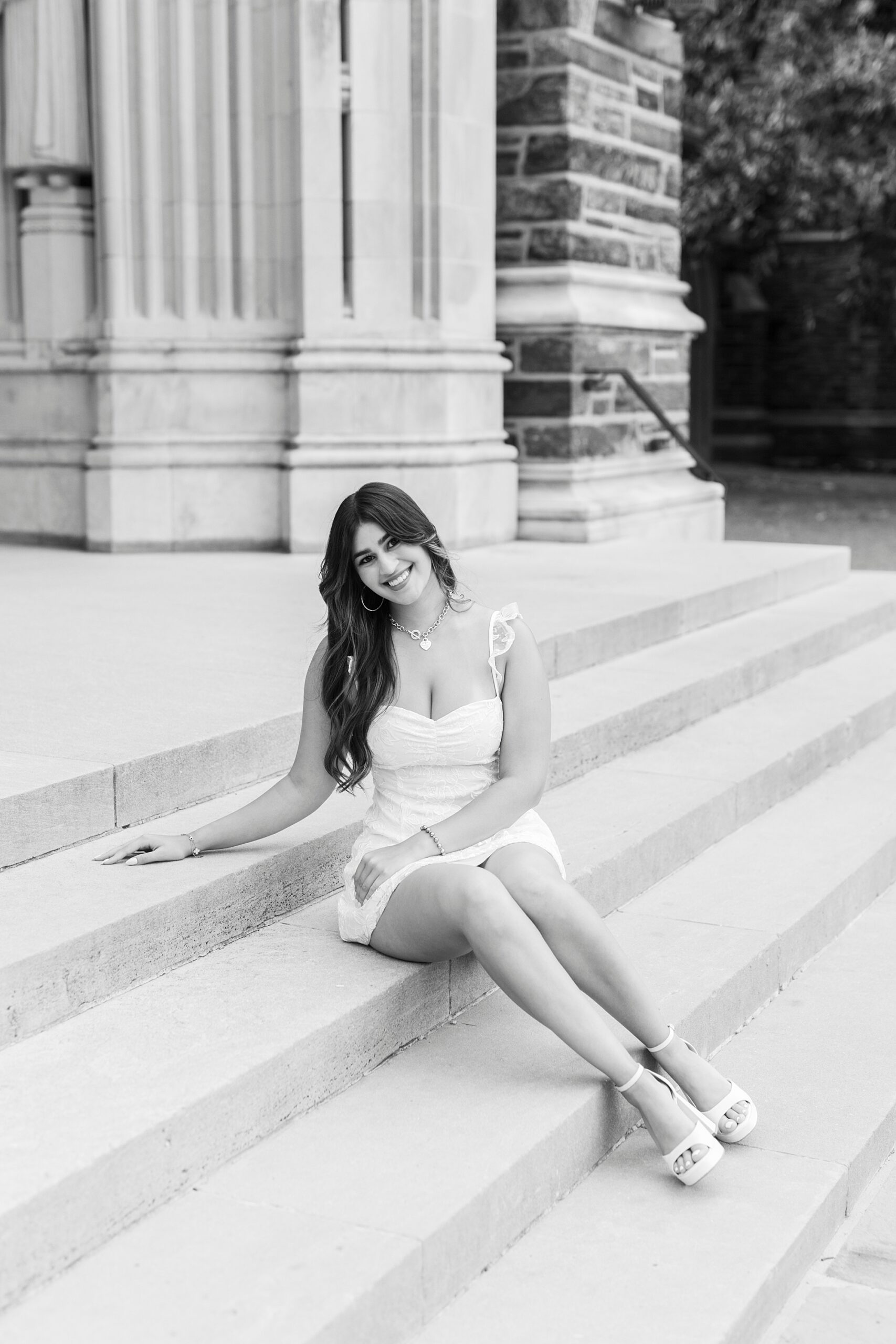 college student sits on steps of Duke Chapel