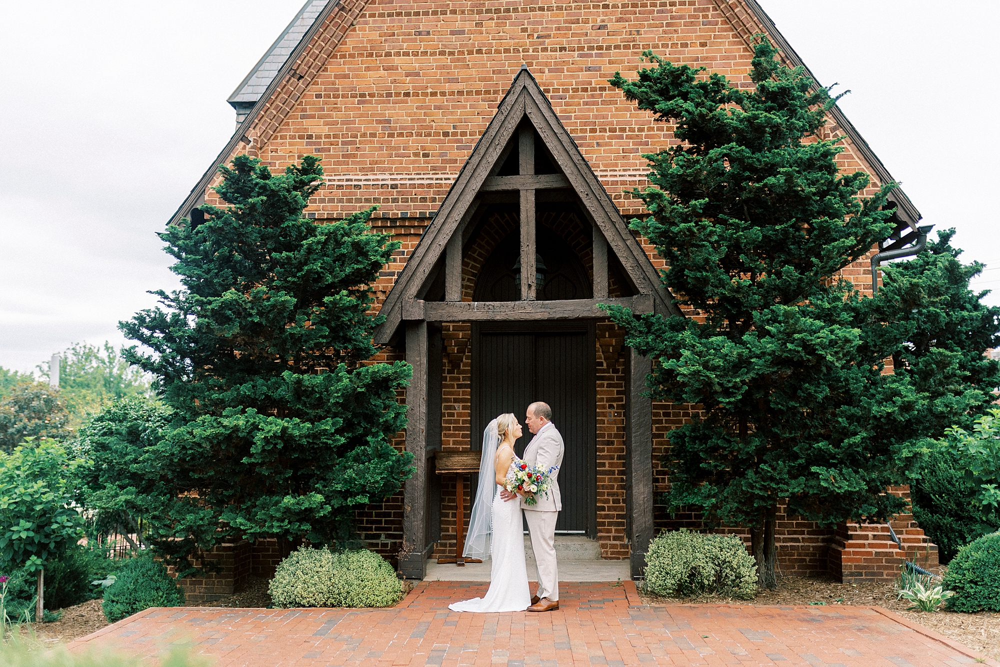 bride and groom look at each other outside St. Mary's Chapel
