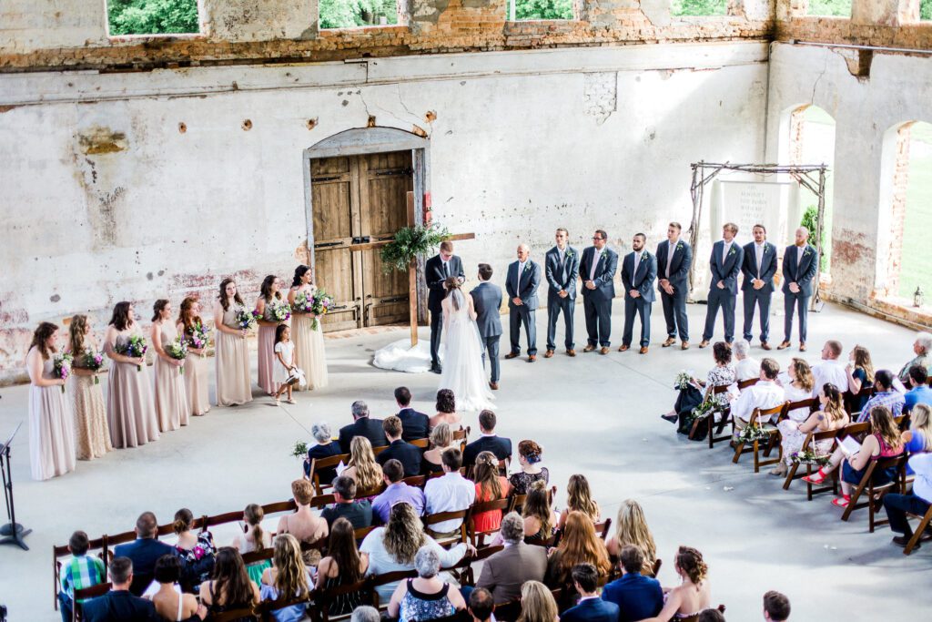 wedding ceremony inside historic mill building at the providence cotton mill 
