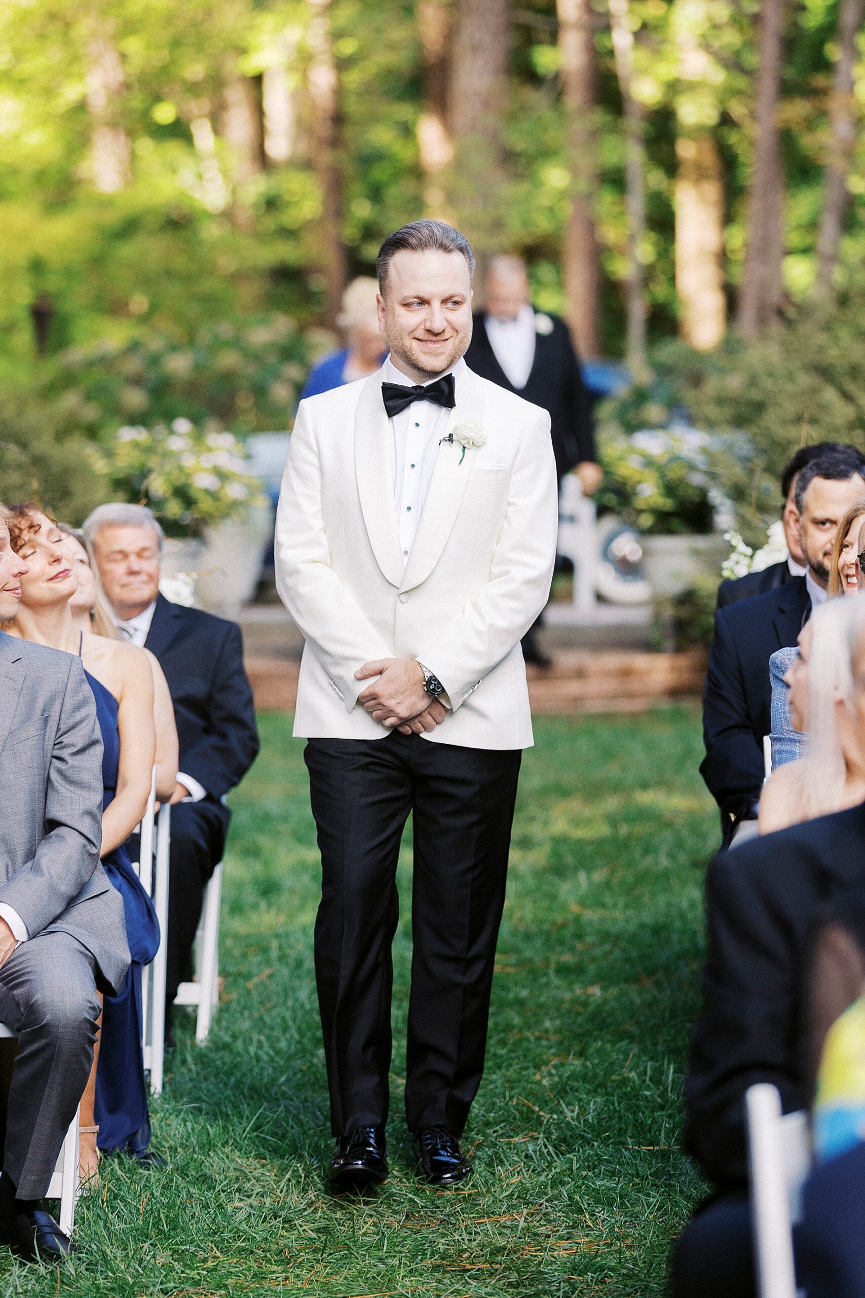 groom walking down aisle  