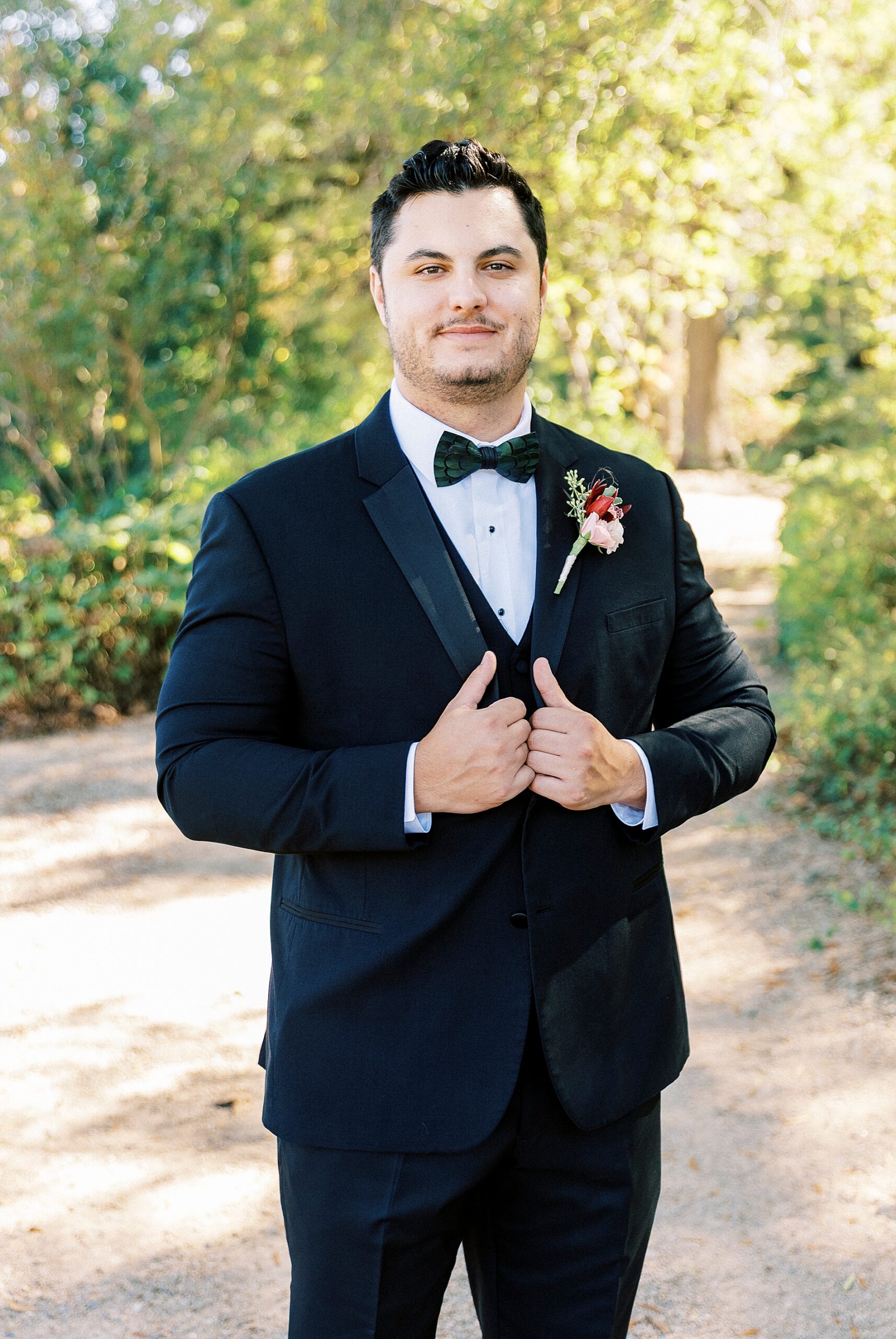 groom portraits on black tux